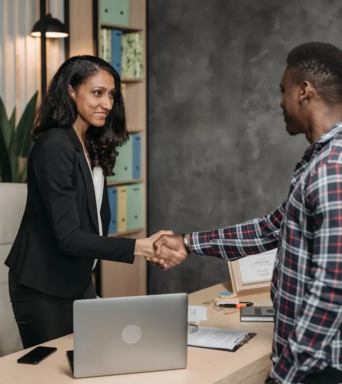 Professionals shaking hands as they share the same ai marketing vision!